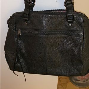 Black purse from The Sak